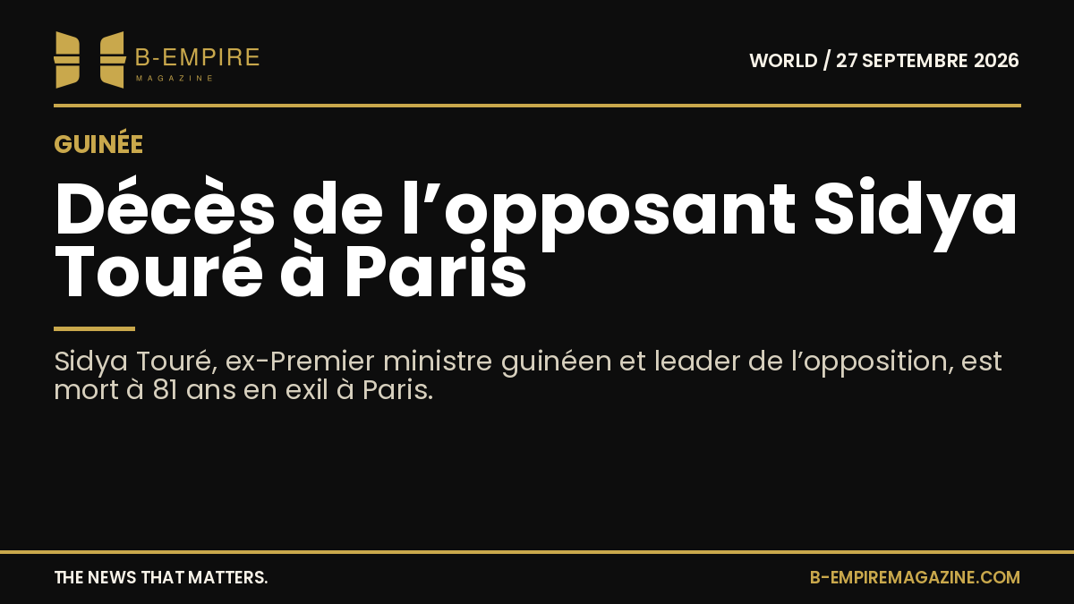 Portrait de Sidya Touré, homme politique guinéen, en costume, souriant.